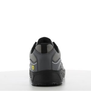 Giày Safety Jogger AAK S1P Low nhìn từ phía sau, gót ốp xám đậm, logo ESD vàng, đế Phylon/Rubber đen bản rộng